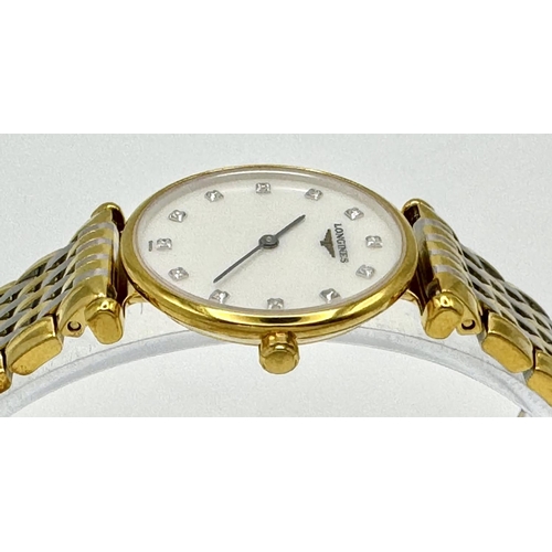 74 - A LADIES LONGINE BI-METAL WATCH WITH DIAMOND NUMERALS ON A MOTHER OF PEARL DIAL, MANUAL MOVEMENT IN ... 