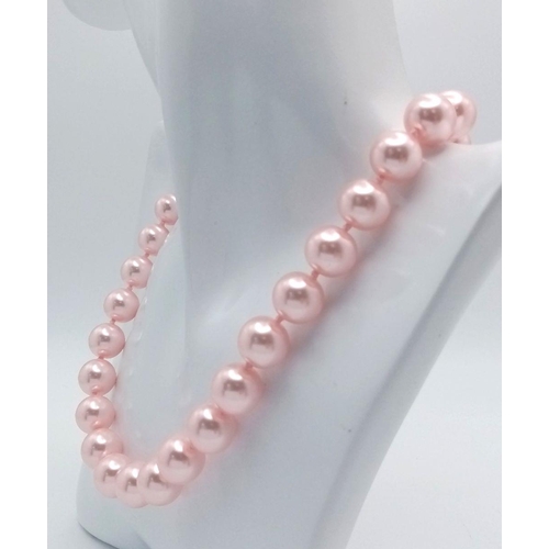 768 - A Chic Pink South Sea Pearl Shell Beaded Necklace. 12mm beads. 48cm necklace length.