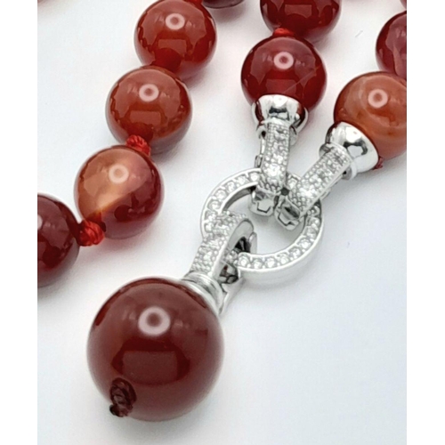 831 - A Luscious Red Striped Agate Beaded Necklace with Drop Pendant - 5cm. Beads - 10mm. Necklace length ... 