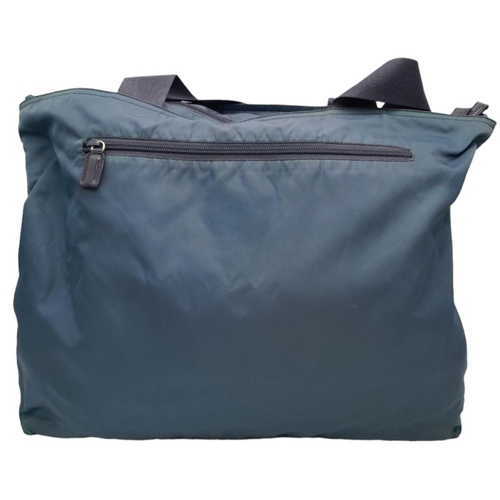 253 - A Blue Prada Tote Bag. Nylon exterior, silver-tone hardware, double flat nylon handles, having one m... 