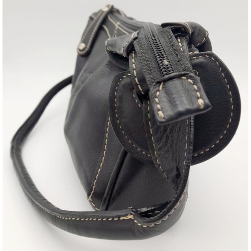 284 - A Vintage Balenciaga shoulder bag. Black leather exterior, white contrast stitching that highlights ... 