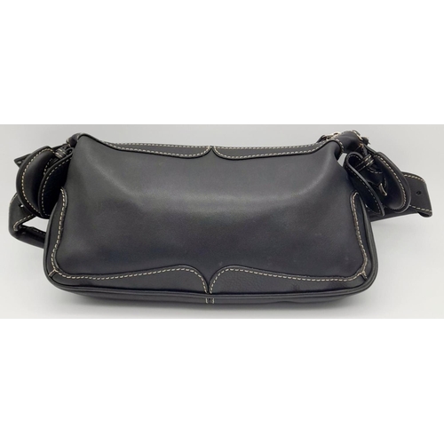 284 - A Vintage Balenciaga shoulder bag. Black leather exterior, white contrast stitching that highlights ... 