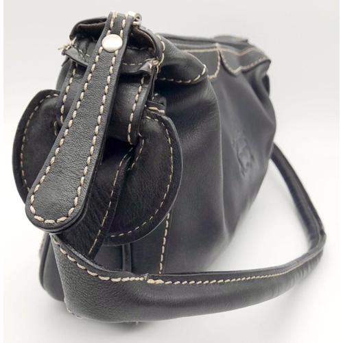 284 - A Vintage Balenciaga shoulder bag. Black leather exterior, white contrast stitching that highlights ... 