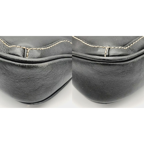 284 - A Vintage Balenciaga shoulder bag. Black leather exterior, white contrast stitching that highlights ... 