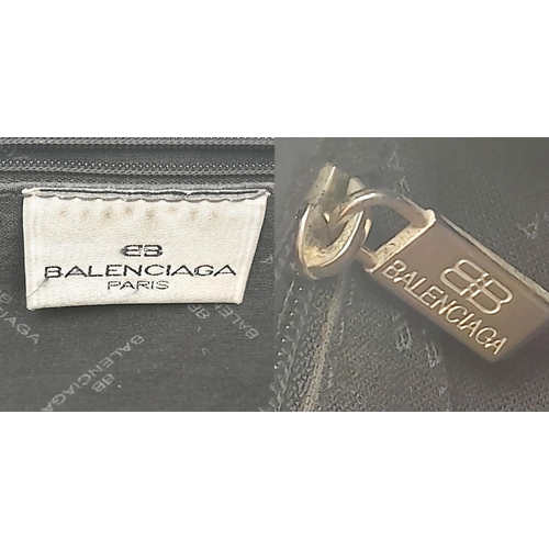 284 - A Vintage Balenciaga shoulder bag. Black leather exterior, white contrast stitching that highlights ... 