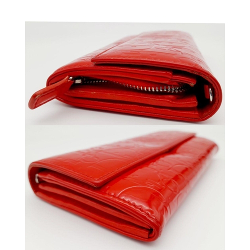 291 - A Christian Dior Red Patent Logo Embossed 'Ultimate' Continental Wallet. Leather exterior, silver-to... 