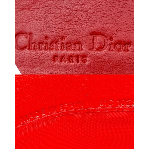 291 - A Christian Dior Red Patent Logo Embossed 'Ultimate' Continental Wallet. Leather exterior, silver-to... 