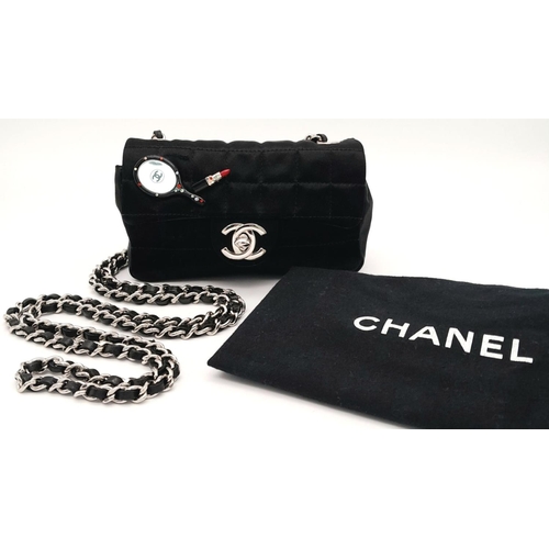 52 - A Chanel Classic Mini Flap Bag. Black textile quilted exterior, silver-tone hardware and chain, mini... 