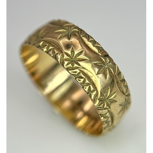 100 - a 9k gold patterned band ring .    2.5gms    size Q