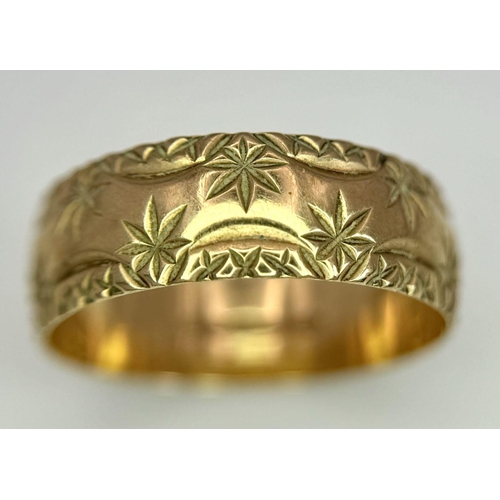 100 - a 9k gold patterned band ring .    2.5gms    size Q