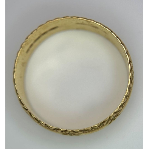 100 - a 9k gold patterned band ring .    2.5gms    size Q