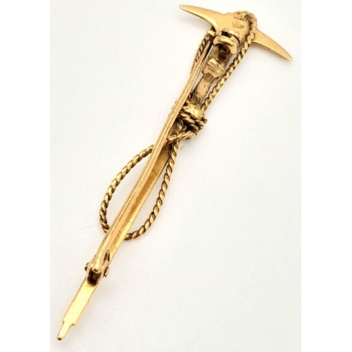 112 - A vintage, Swiss, 10 K yellow gold Mountaineering Ice Axe and Rope brooch. Traditionally these brooc... 