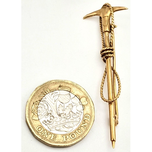 112 - A vintage, Swiss, 10 K yellow gold Mountaineering Ice Axe and Rope brooch. Traditionally these brooc... 