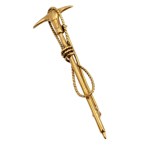 112 - A vintage, Swiss, 10 K yellow gold Mountaineering Ice Axe and Rope brooch. Traditionally these brooc... 