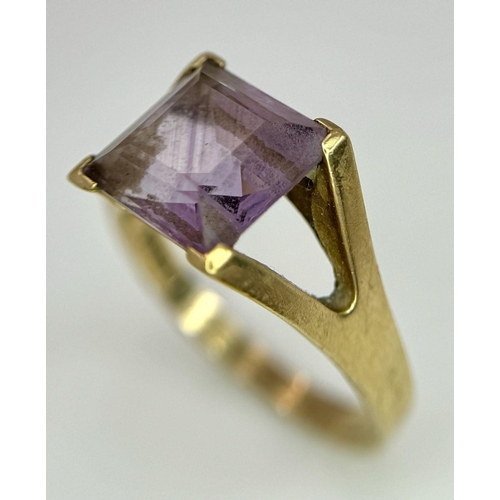 114 - A 9K GOLD DRESS RING WITH AMETHYST COLOURED SQUARE STONE .    5gms   size T