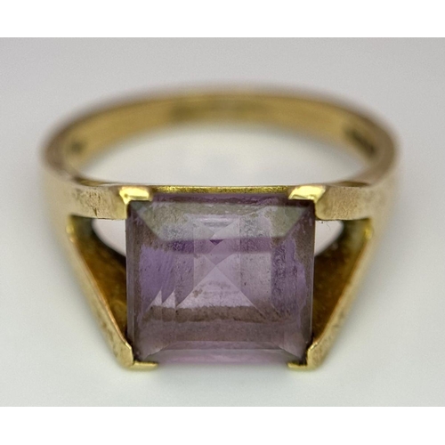 114 - A 9K GOLD DRESS RING WITH AMETHYST COLOURED SQUARE STONE .    5gms   size T