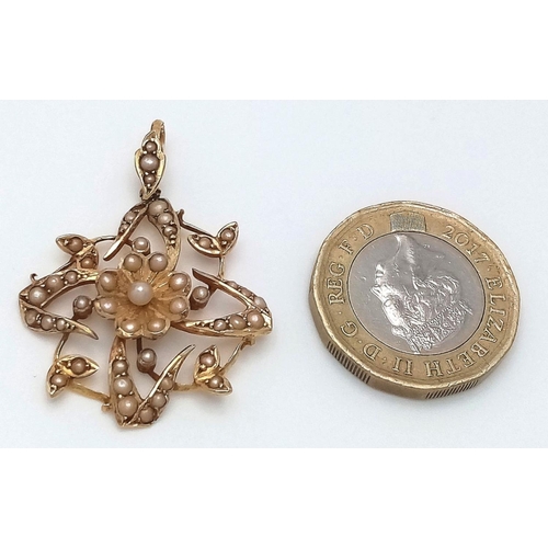 121 - A VICTORIAN 18K GOLD PENDANT WITH SEED PEARL DECORATION .   3.9gms