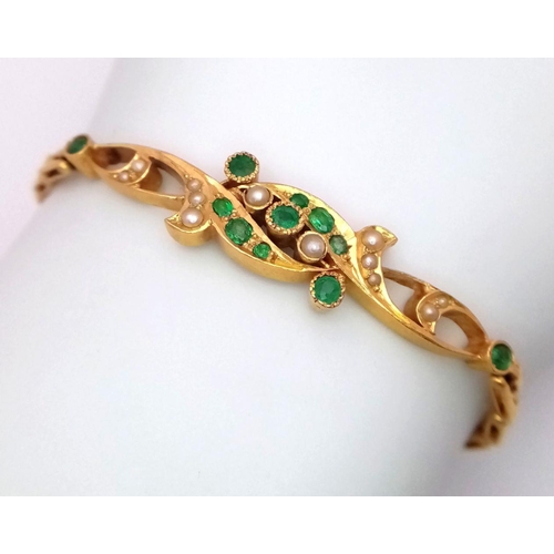 43 - An 18K Yellow Gold (tested) Emerald and Pearl Bracelet. Rich green emeralds and seed pearls in a rev... 