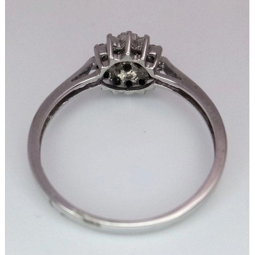 551 - A 9K WHITE GOLD DIAMOND CLUSTER RING - 2G. SIZE P