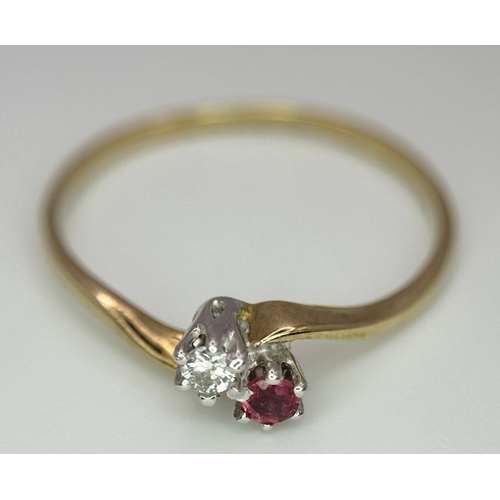 737 - A 9K YELLOW GOLD DIAMOND & RUBY 2 STONE TWIST RING. 0.9G. SIZE O.