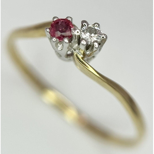 737 - A 9K YELLOW GOLD DIAMOND & RUBY 2 STONE TWIST RING. 0.9G. SIZE O.