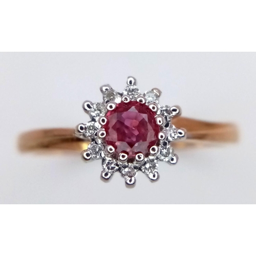 744 - A 9K YELLOW GOLD DIAMOND & RUBY CLUSTER RING. 2.4G. SIZE Q