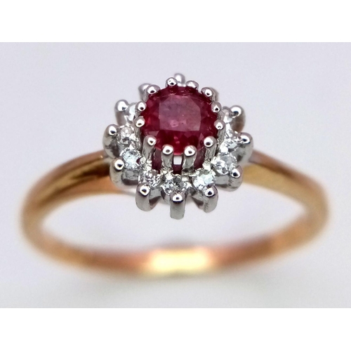 744 - A 9K YELLOW GOLD DIAMOND & RUBY CLUSTER RING. 2.4G. SIZE Q