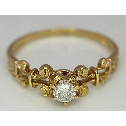 751 - A 9K YELLOW GOLD FANCY DIAMOND SOLITAIRE RING. 0.12CT 1.4G SIZE M