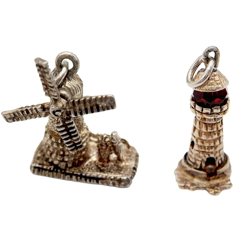 783 - 2 X STERLING SILVER CHARMS WINDMILL & LIGHTHOUSE 6.3G.

SC 1071