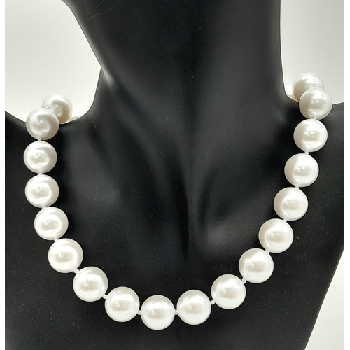 1259 - A Bright White South Sea Pearl Shell Bead Necklace. 14mm beads. 40cm. Gilded clasp.