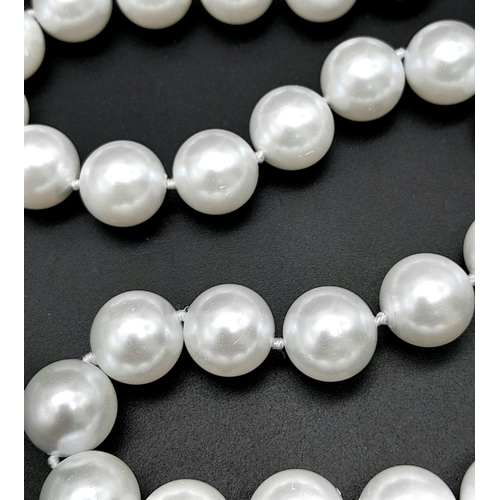 1259 - A Bright White South Sea Pearl Shell Bead Necklace. 14mm beads. 40cm. Gilded clasp.