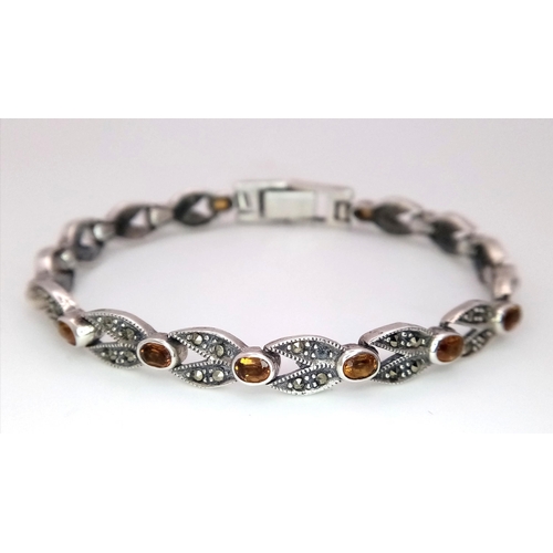 906 - A Marcasite and Citrine Bracelet. White metal, boxed. 18cm