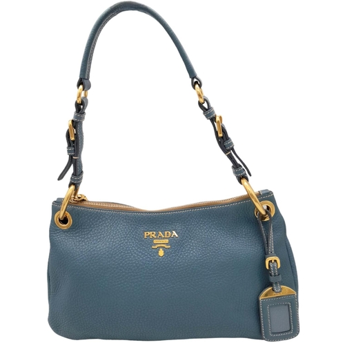 801 - A Prada Marine Blue Vitello Daino Shoulder Bag. Leather exterior with gold-toned hardware, adjustabl... 