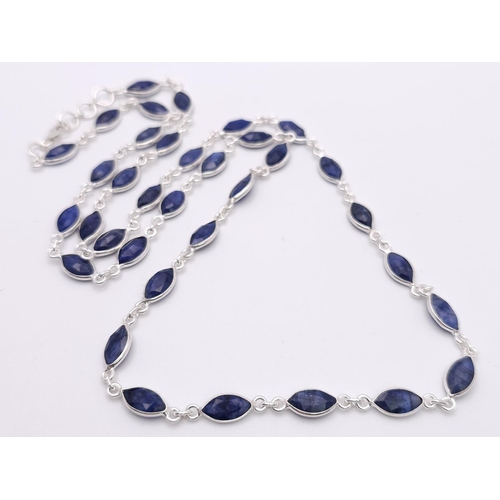 660 - A Marquise Shape Blue Sapphire Long Chain Necklace. Set in 925 Silver. 62cm. Ref: CD-1318