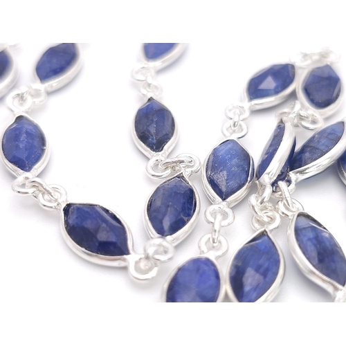 660 - A Marquise Shape Blue Sapphire Long Chain Necklace. Set in 925 Silver. 62cm. Ref: CD-1318