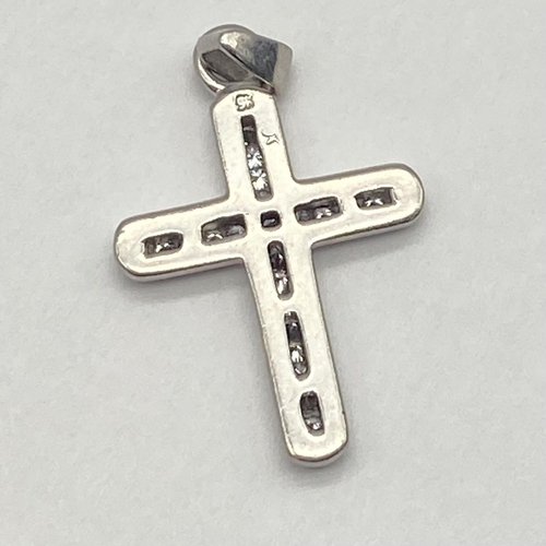 852 - A 9K White Gold Diamond Cross Pendant. 4cm x 2cm. 4.5g total weight.