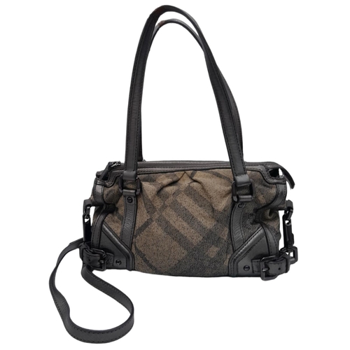 626 - A Burberry Metallic Grey Smoke Check Bag. Canvas exterior with leather trim, leather straps, black-t... 