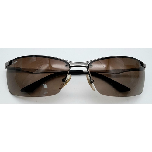 127 - A Pair of Ray Ban Sunglasses - With case that needs restitching.