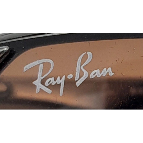 127 - A Pair of Ray Ban Sunglasses - With case that needs restitching.