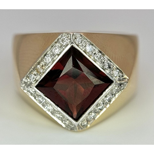 909 - AN 18K YELLOW GOLD, DIAMOND AND RED STONE RING. SIZE M1/2.  10.4G