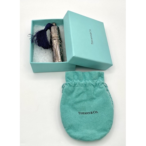 711 - A  TIFFANY & CO sterling silver perfume bottle with original pouch and presentation box. Dimensions:... 