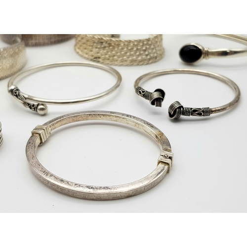 829 - A sterling silver job lot consisting of four pearl necklaces, 7 bangles. 1 pendant and  1 ring size:... 