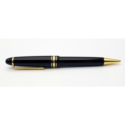 823 - A Montblanc Meisterstruck Black and Gold Tone Ball Point Pen. 15cm. Ref: 016938