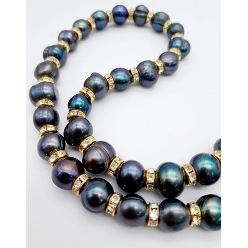 161 - A genuine, black pearl necklace from the South China Sea. The pearls are of mature age with black ir... 