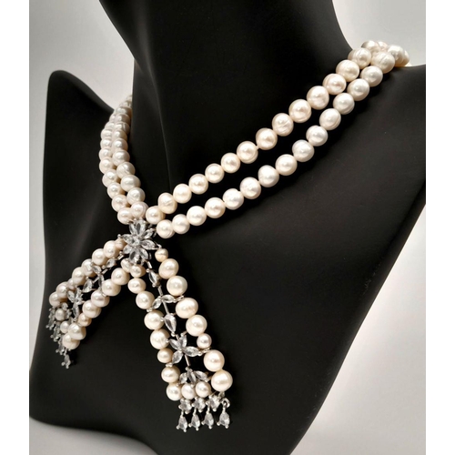 196 - A fabulously designed pearl necklace with cubic zirconia. The genuine natural white pearls are of ex... 