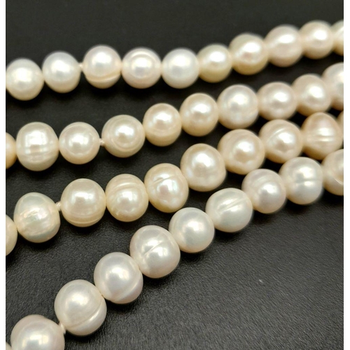 196 - A fabulously designed pearl necklace with cubic zirconia. The genuine natural white pearls are of ex... 