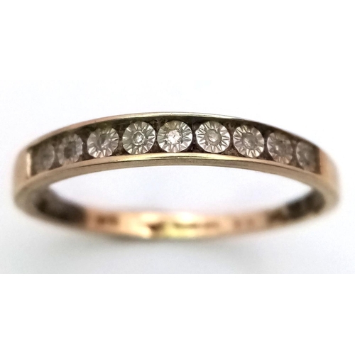 198 - A 9K GOLD RING WITH 9 CHANNEL SET DIAMONDS ,   1.1gms   size P