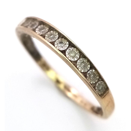 198 - A 9K GOLD RING WITH 9 CHANNEL SET DIAMONDS ,   1.1gms   size P