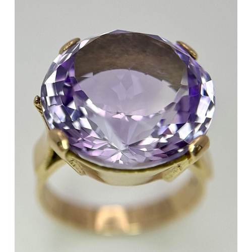 401 - A Gorgeous 18K Yellow Gold and Amethyst Ring. A clean, well faceted large round cut amethyst is the ... 