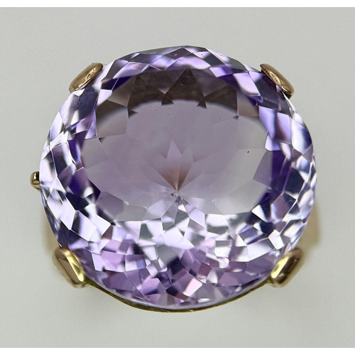 401 - A Gorgeous 18K Yellow Gold and Amethyst Ring. A clean, well faceted large round cut amethyst is the ... 